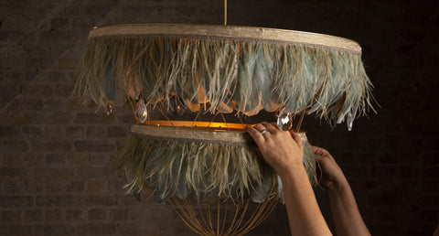 Luxury feather chandelier. Decorative lighting with feathers. Green feather light shade