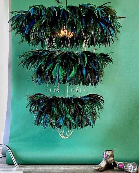 Feather chandelier. Three tiered feather lighting feature in greens and blues. Perfect atrium lighting.